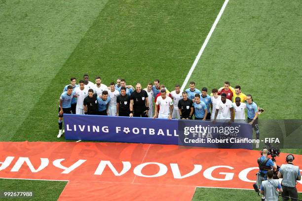 Uruguay and France players gather behind a FIFA Fair Play sign prior to the 2018 FIFA World Cup Russia Quarter Final match between Uruguay and France...