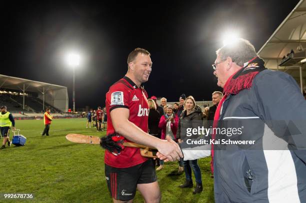 Wyatt Crockett of the Crusaders is congratulated by fans after his 200th Super Rugby match during the round 18 Super Rugby match between the...