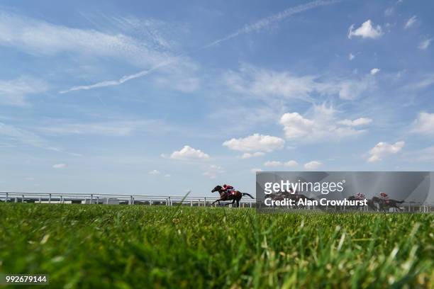 Adam Kirby riding King Of Comedy win The Good Care Group British EBF Novice Stakes at Sandown Park on July 6, 2018 in Esher, United Kingdom.
