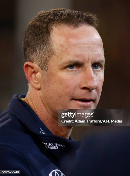 Don Pyke, Senior Coach of the Crows addresses his players during the 2018 AFL round 16 match between the Richmond Tigers and the Adelaide Crows at...