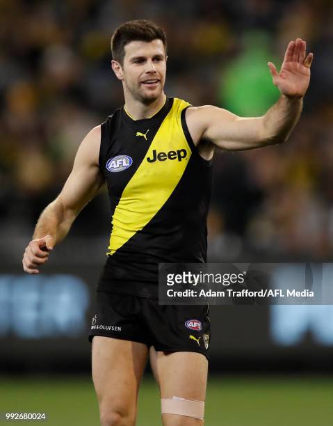 Trent Cotchin of the Tigers congratulates Jack Riewoldt of the Tigers on a goal during the 2018 AFL round 16 match between the Richmond Tigers and...