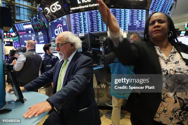 Traders work on the floor of the New York Stock Exchange on July 6, 2018 in New York City. After the U.S. Levied tariffs on $34 billion worth of...