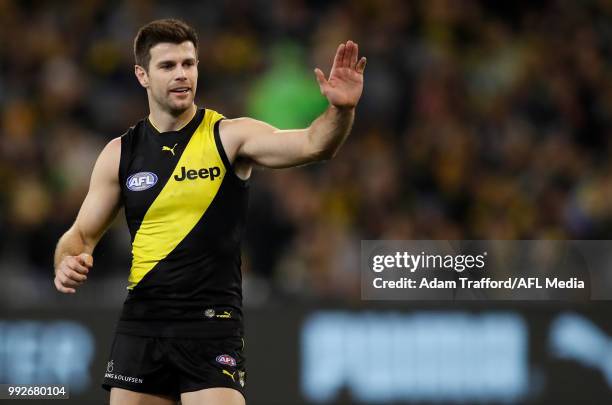 Trent Cotchin of the Tigers congratulates Jack Riewoldt of the Tigers on a goal during the 2018 AFL round 16 match between the Richmond Tigers and...