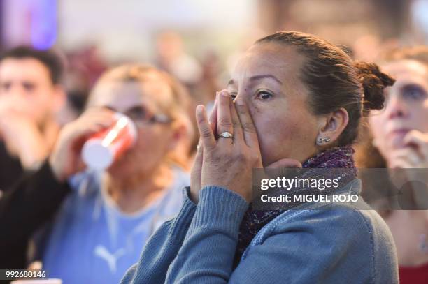 Fans of Uruguay attend the broadcasting of the Russia 2018 FIFA World Cup football match Uruguay against France on a big screen at the Mercado...