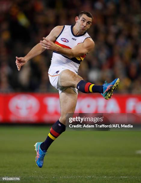 Taylor Walker of the Crows kicks the ball during the 2018 AFL round 16 match between the Richmond Tigers and the Adelaide Crows at the Melbourne...