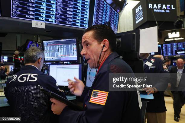 Traders work on the floor of the New York Stock Exchange on July 6, 2018 in New York City. After the U.S. Levied tariffs on $34 billion worth of...