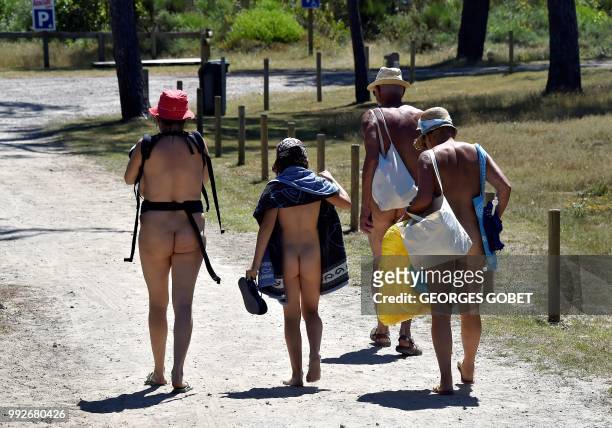Graphic content / Naked people walk at the Arnaoutchot naturist camping on June 26, 2018 in Vielle-Saint-Girons, southwestern France. - According to...