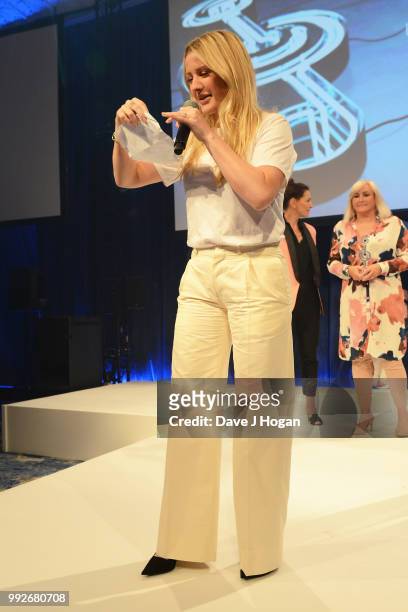 Ellie Goulding, winner of the Liz Hobbs Group Best Female Award on stage during the Nordoff Robbins' O2 Silver Clef Awards ceremony at Grosvenor...