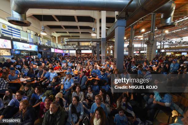 Fans of Uruguay attend the broadcasting of the Russia 2018 FIFA World Cup football match Uruguay against France on a big screen at the Mercado...