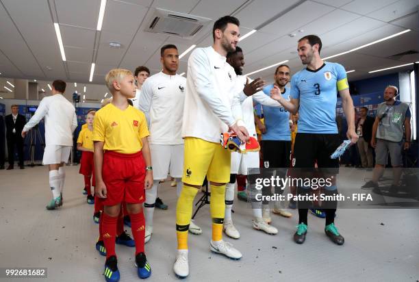 France and Uruguay teams line up in the tunnel ahead of the 2018 FIFA World Cup Russia Quarter Final match between Uruguay and France at Nizhny...