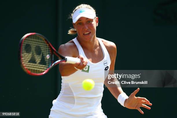 Yanina Wickmayer of Belgium returns a shot against Donna Vekic of Croatia during their Ladies' Singles third round match on day five of the Wimbledon...