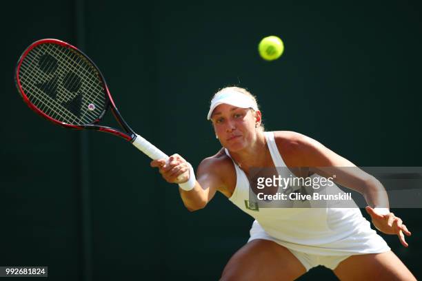 Yanina Wickmayer of Belgium returns a shot against Donna Vekic of Croatia during their Ladies' Singles third round match on day five of the Wimbledon...
