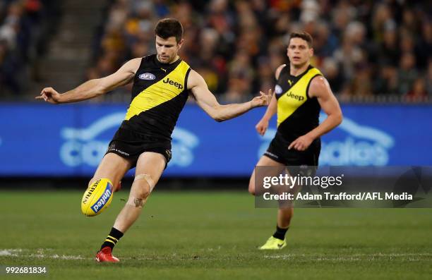 Trent Cotchin of the Tigers kicks the ball during the 2018 AFL round 16 match between the Richmond Tigers and the Adelaide Crows at the Melbourne...