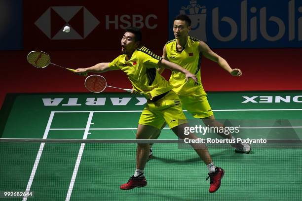 Liu Cheng and Zhang Nan of China compete against Fajar Alfian and Muhammad Rian Ardianto of Indonesia during the Men's Doubles Quarter-final match on...