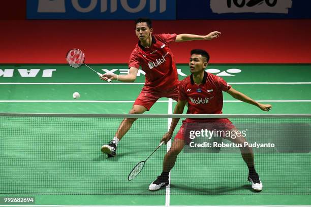 Fajar Alfian and Muhammad Rian Ardianto of Indonesia compete against Liu Cheng and Zhang Nan of China during the Men's Doubles Quarter-final match on...