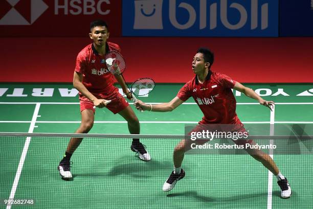 Fajar Alfian and Muhammad Rian Ardianto of Indonesia compete against Liu Cheng and Zhang Nan of China during the Men's Doubles Quarter-final match on...