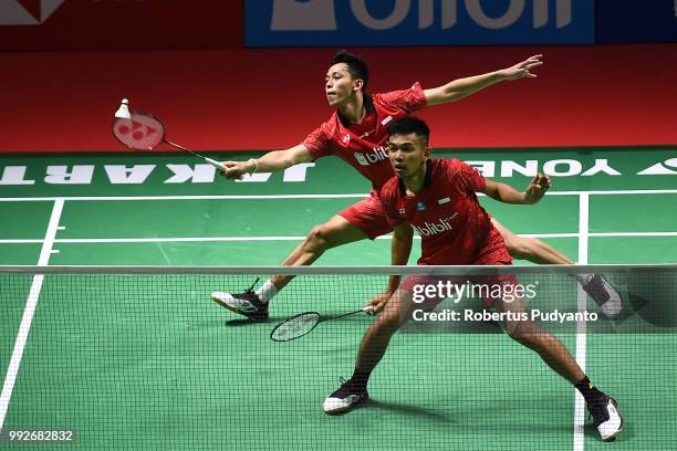 Fajar Alfian and Muhammad Rian Ardianto of Indonesia compete against Liu Cheng and Zhang Nan of China during the Men's Doubles Quarter-final match on...