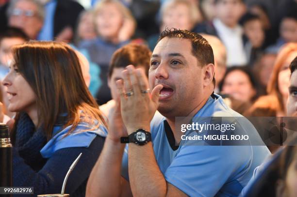 Fans of Uruguay attend the broadcasting of the Russia 2018 FIFA World Cup football match Uruguay against France on a big screen at the Mercado...