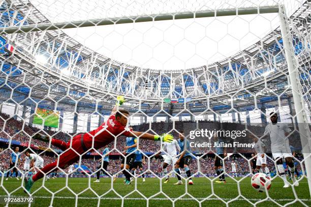 Raphael Varane of France scores his sides first goal past Fernando Muslera of Uruguay during the 2018 FIFA World Cup Russia Quarter Final match...