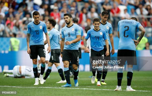 Matias Vecino, Luis Suarez, Lucas Torreira and Jose Gimenez of Uruguay look on during the 2018 FIFA World Cup Russia Quarter Final match between...