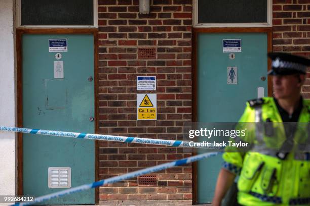 Police officer stands at a cordon in place around male and female public toilets at Queen Elizabeth Gardens in Salisbury after a major incident was...