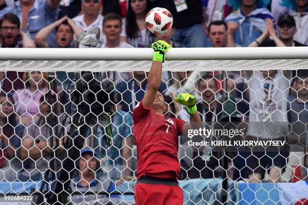 Uruguay's goalkeeper Fernando Muslera grabs the crossbar as the ball passes above it during the Russia 2018 World Cup quarter-final football match...