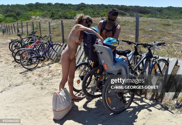 Graphic content / Naked people arrive on the beach of the Arnaoutchot naturist camping on June 26, 2018 in Vielle-Saint-Girons, southwestern France....