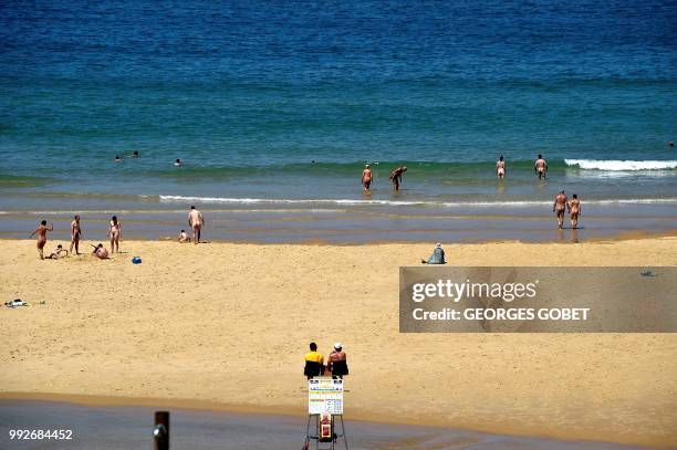 Graphic content / Naked people take bathe at the beach of the Arnaoutchot naturist camping on June 26, 2018 in Vielle-Saint-Girons, southwestern...