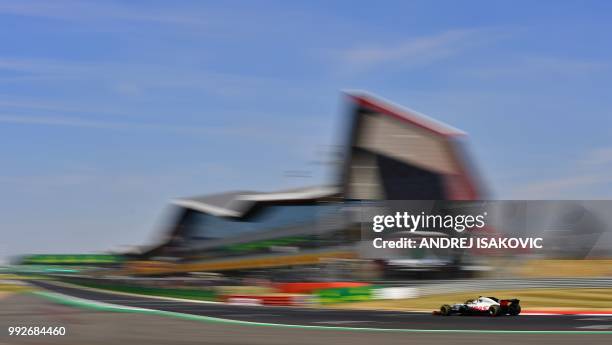 Haas F1's Danish driver Kevin Magnussen drives during the second practice session at Silverstone motor racing circuit in Silverstone, central...