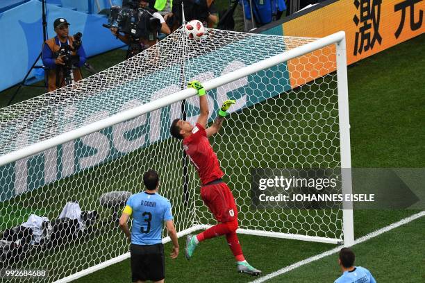 Uruguay's goalkeeper Fernando Muslera jumps to clear the ball over the cross bar during the Russia 2018 World Cup quarter-final football match...