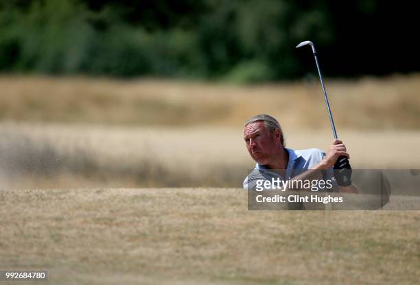 David Greenwood of Turton Golf Club plays out of a bunker on the 10th green during the Lombard Trophy North Qualifier at Fairhaven Golf Club on July...