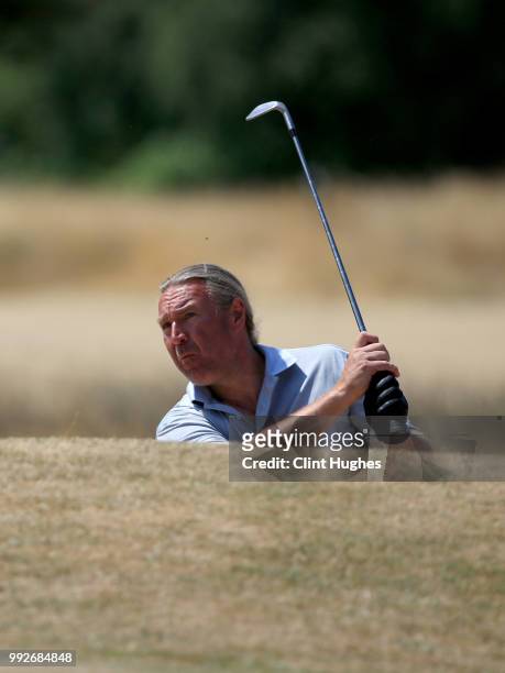 David Greenwood of Turton Golf Club plays out of a bunker on the 10th green during the Lombard Trophy North Qualifier at Fairhaven Golf Club on July...