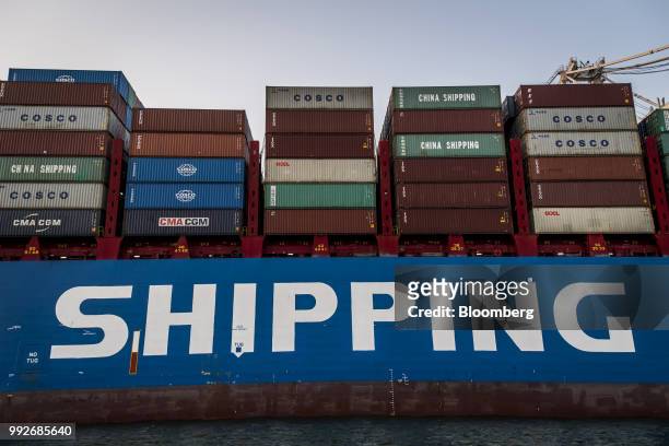Shipping containers sit on the CSCL South China Sea cargo ship at the Port of Oakland in Oakland, California, U.S., on Tuesday, July 3, 2018....