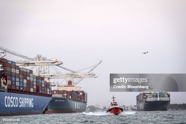 Pilot boat passes container ships at the Port of Oakland in Oakland, California, U.S., on Tuesday, July 3, 2018. President Donald Trump threatened to...