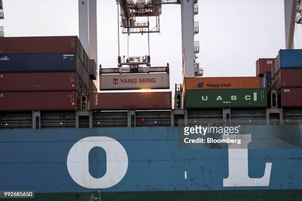 Shipping container is loaded onto the Mol Prestige ship at the Port of Oakland in Oakland, California, U.S., on Tuesday, July 3, 2018....