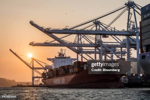 The Hamburg Sud North America Inc. Cap Capricorn ship sits during sunset at the Port of Oakland in Oakland, California, U.S., on Tuesday, July 3,...