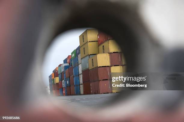 Shipping containers sit stacked at the Port of Oakland in Oakland, California, U.S., on Thursday, July 5, 2018. President Donald Trump threatened to...