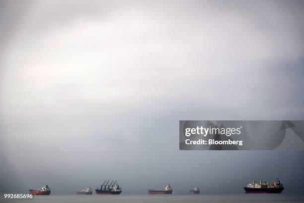 Vessels sit anchored in San Francisco Bay near the Port of Oakland in Oakland, California, U.S., on Thursday, July 5, 2018. President Donald...