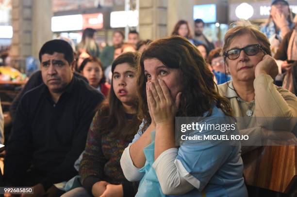 Fans of Uruguay attend the broadcasting of the Russia 2018 FIFA World Cup football match Uruguay against France on a big screen at the Mercado...