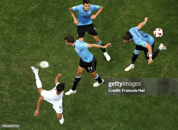 Raphael Varane of France scores his team's first goal during the 2018 FIFA World Cup Russia Quarter Final match between Uruguay and France at Nizhny...