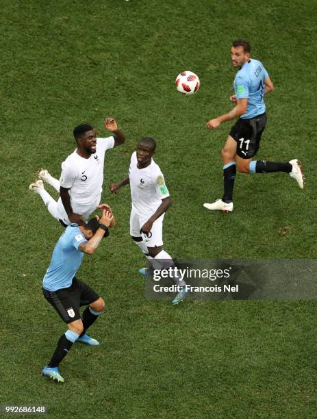 Samuel Umtiti of France wins a header over Luis Suarez of Uruguay during the 2018 FIFA World Cup Russia Quarter Final match between Uruguay and...
