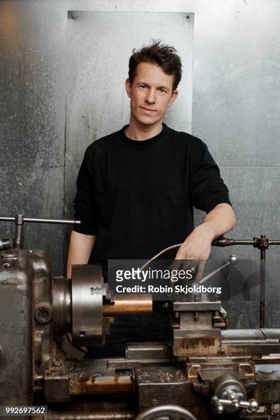 portrait of blacksmith standing behind lathe machine - steel worker stock pictures, royalty-free photos & images