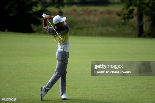 Whee Kim of Korea hits his second shot on the 13th hole during round two of A Military Tribute At The Greenbrier held at the Old White TPC course on...