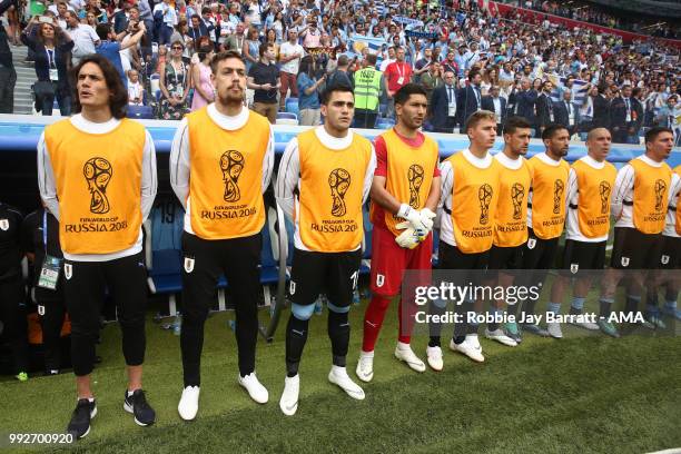 Edison Cavani of Uruguay stands with his team-mates prior to the 2018 FIFA World Cup Russia Quarter Final match between Uruguay and France at Nizhny...