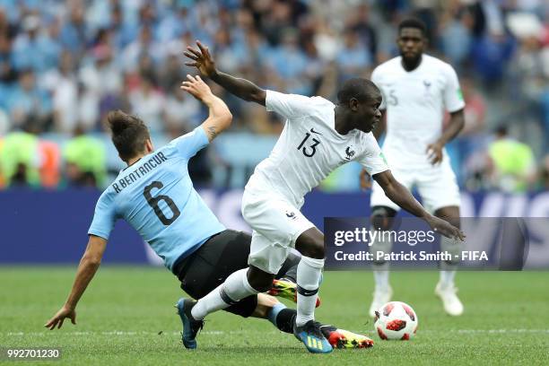 Ngolo Kante of France tackles Rodrigo Bentancur of Uruguay during the 2018 FIFA World Cup Russia Quarter Final match between Uruguay and France at...