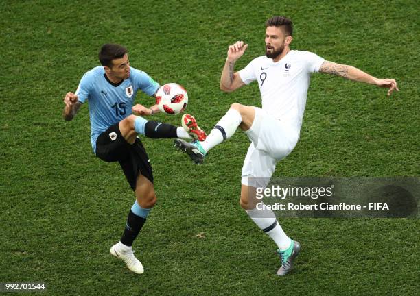 Matias Vecino of Uruguay and Olivier Giroud of France battle for the ball during the 2018 FIFA World Cup Russia Quarter Final match between Uruguay...