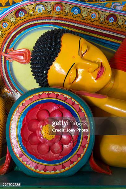 sleeping lion's buddha - reclining buddha statue stock pictures, royalty-free photos & images