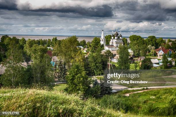 The majestic church is located on the shore of the White Lake and among the green trees