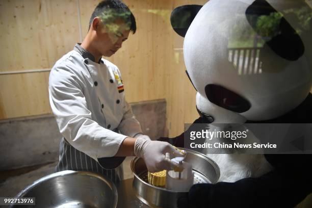 Keepers prepare food for giant pandas at the Yunnan Wildlife Park on July 3, 2018 in Kunming, Yunnan Province of China. Yunnan Wildlife Park opened a...
