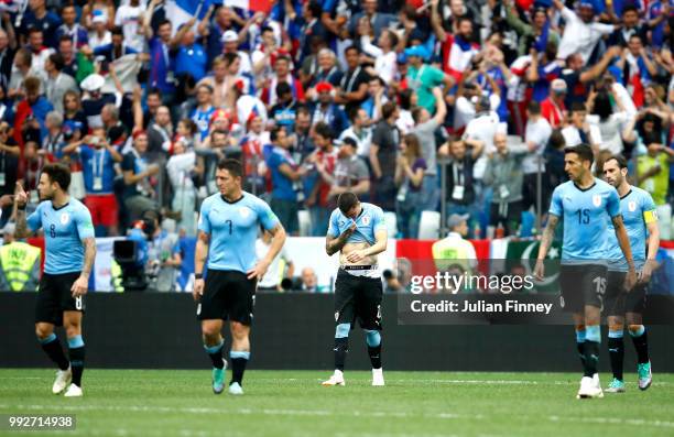 Uruguay players look dejected following France scoring their second goal during the 2018 FIFA World Cup Russia Quarter Final match between Uruguay...